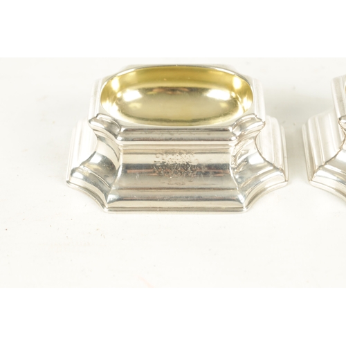 478 - A SET OF FOUR GEORGE II SILVER AND SILVER GILT TRENCHER SALTS with moulded bodies having crest marks... 