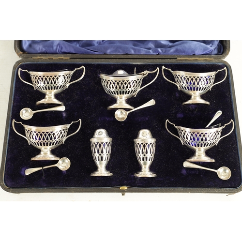 479 - A LATE VICTORIAN CASED TABLE CONDIMENT SET comprising a lidded mustard pot, 4 open salts and spoons ... 