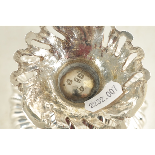 480 - A GEORGE III ROCOCO STYLE SILVER SUGAR BOWL AND COVER decorated with scrolling floral work standing ... 