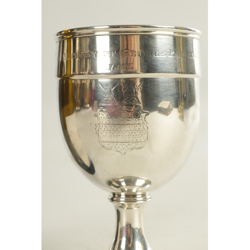 481 - AN EARLY VICTORIAN SILVER GOBLET of plain engraved crested design with inscribed date, on a ribbed p... 