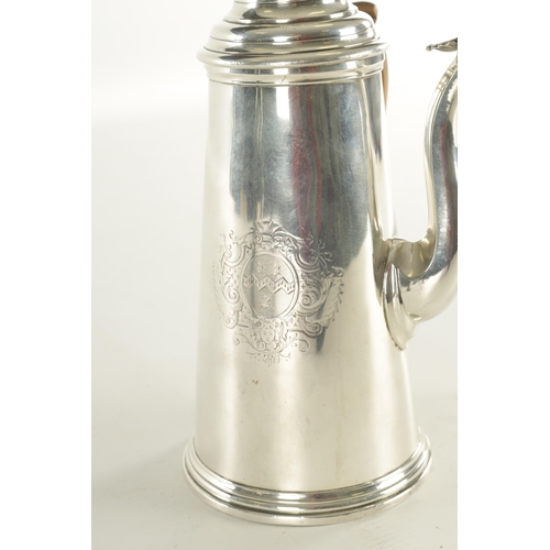 484 - A QUEEN ANNE SILVER CHOCOLATE POT with tapering body, shield decoration, conical stepped lids and si... 