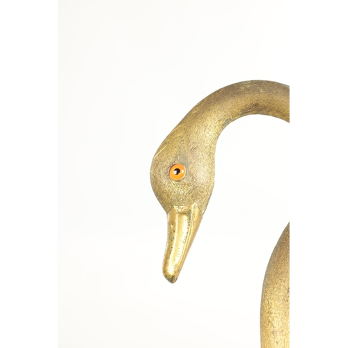 494 - A LATE 19TH CENTURY GILT METAL SWAN'S HEAD WALKING STICK with crook handle having glass eyes and mou... 