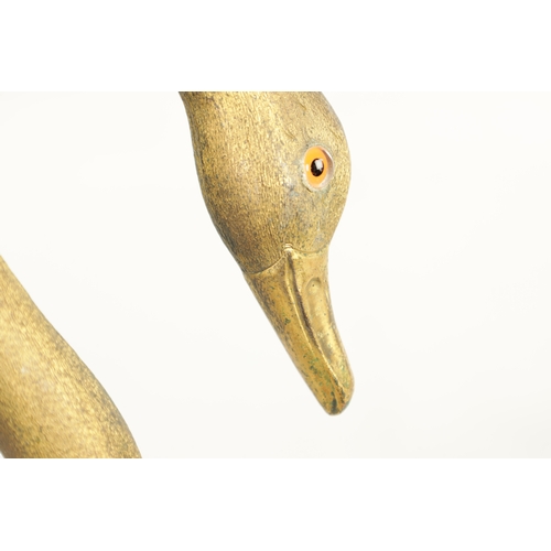 494 - A LATE 19TH CENTURY GILT METAL SWAN'S HEAD WALKING STICK with crook handle having glass eyes and mou... 