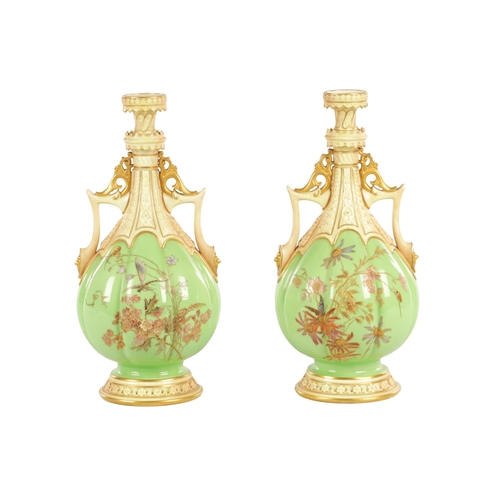 50 - A FINE AND UNUSUAL PAIR OF ROYAL WORCESTER CABINET VASES the sage green lobed panelled bodies finely... 