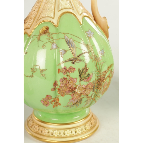 50 - A FINE AND UNUSUAL PAIR OF ROYAL WORCESTER CABINET VASES the sage green lobed panelled bodies finely... 