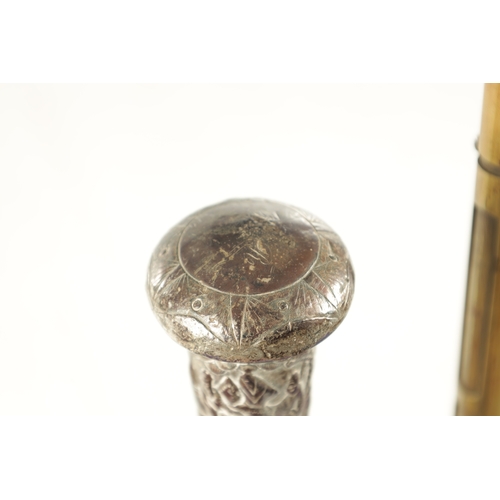 500 - TWO LATE 19TH CENTURY CHINESE SILVER TOPPED WALKING STICKS with figural silver metal tops on malacca... 