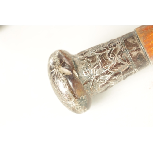 500 - TWO LATE 19TH CENTURY CHINESE SILVER TOPPED WALKING STICKS with figural silver metal tops on malacca... 