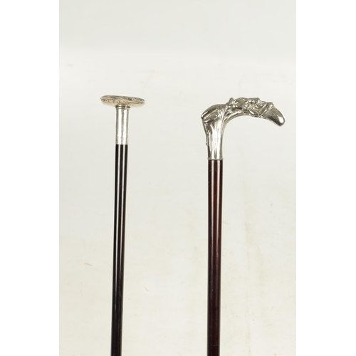 505 - A LATE 19TH CENTURY SILVER CUSHION TOPPED WALKING STICK TOGETHER WITH A SILVER PLATED ART NOVEAU STY... 