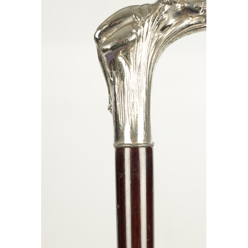 505 - A LATE 19TH CENTURY SILVER CUSHION TOPPED WALKING STICK TOGETHER WITH A SILVER PLATED ART NOVEAU STY... 