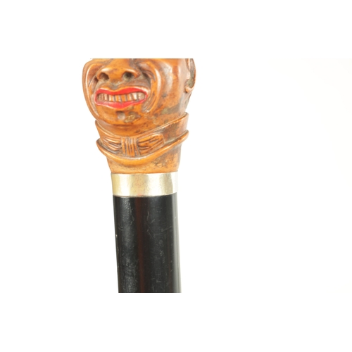 507 - A LATE 19TH CENTURY CARVED BOX WOOD CARICATURE HEAD WALKING STICK moulded as a man wearing a hat wit... 