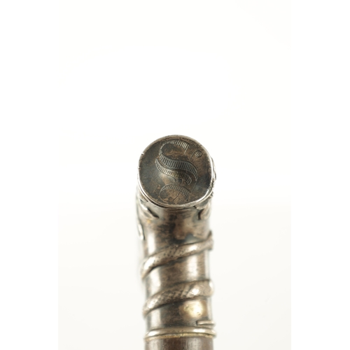 508 - A LATE 19TH CENTURY FRENCH SILVER TOPPED WALKING STICK with leaf and snake moulded top above an ebon... 