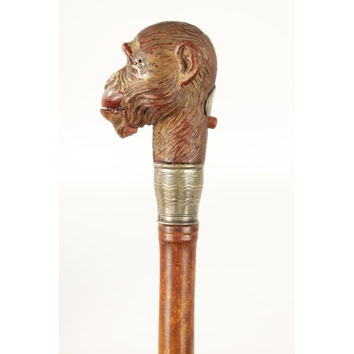 511 - A LATE 19TH CENTURY NOVELTY WALKING STICK FORMED AS A MONKEY HEAD WITH AUTOMATON EYES AND MOUTH fitt... 