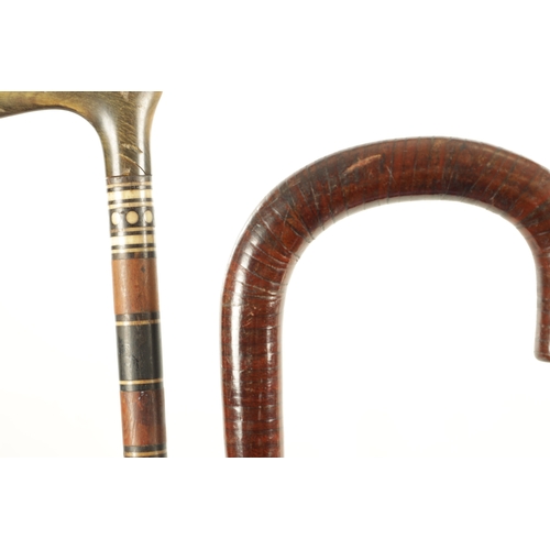 512 - A COLLECTION OF THREE LATE 19TH CENTURY WALKING STICKS comprising of A HORN HANDLED AND SEGMENTED WO... 