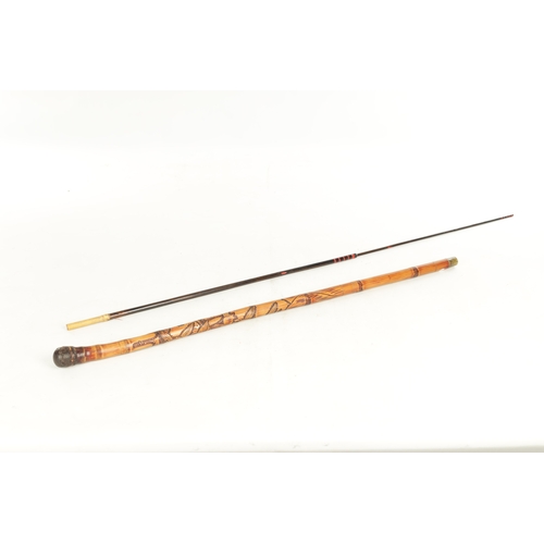 515 - AN EARLY 20TH CENTURY JAPANESE CARVED BAMBOO CARVED STICK WITH FITTED TELESCOPIC FISHING ROD with ro... 