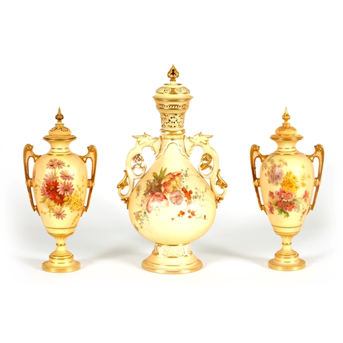 52 - AN ORNATE ROYAL WORCESTER GILT AND IVORY GROUND SCROLLED TWO-HANDLED CABINET VASE AND COVER of bulbo... 