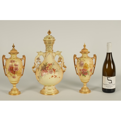 52 - AN ORNATE ROYAL WORCESTER GILT AND IVORY GROUND SCROLLED TWO-HANDLED CABINET VASE AND COVER of bulbo... 