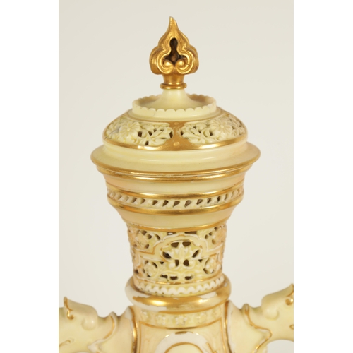 52 - AN ORNATE ROYAL WORCESTER GILT AND IVORY GROUND SCROLLED TWO-HANDLED CABINET VASE AND COVER of bulbo... 