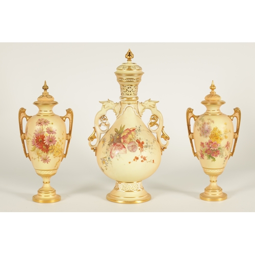 52 - AN ORNATE ROYAL WORCESTER GILT AND IVORY GROUND SCROLLED TWO-HANDLED CABINET VASE AND COVER of bulbo... 