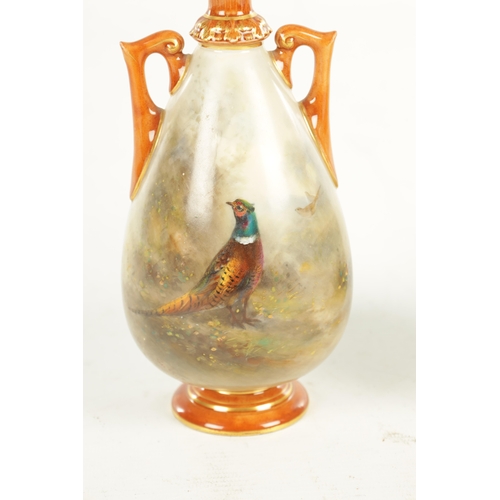 53 - A FINE PAIR OF ROYAL WORCESTER CABINET VASES PAINTED BY JAMES STINTON the ovoid bodies finely painte... 