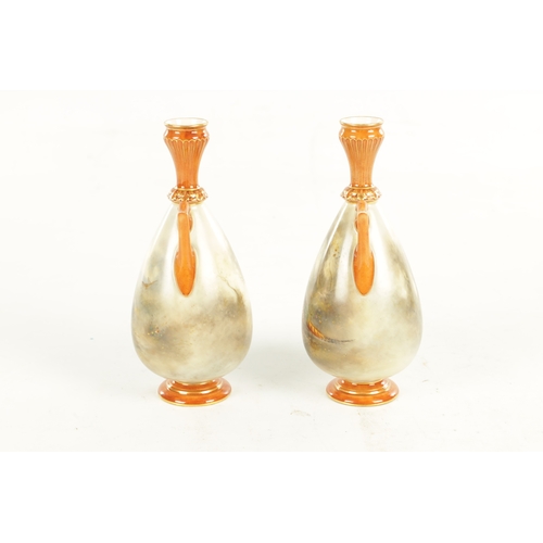 53 - A FINE PAIR OF ROYAL WORCESTER CABINET VASES PAINTED BY JAMES STINTON the ovoid bodies finely painte... 