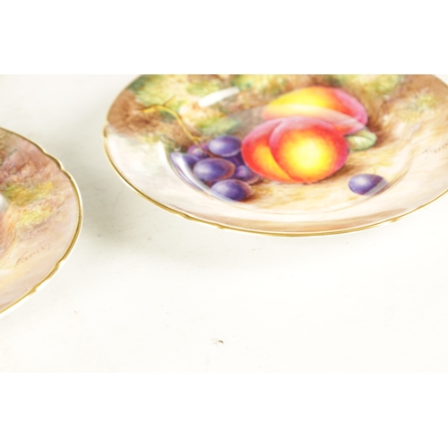 55 - A PAIR OF MID 20TH CENTURY ROYAL WORCESTER CABINET PLATES PAINTED WITH FRUIT signed Freeman with bla... 