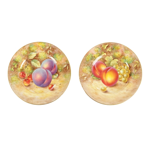 59 - A PAIR OF MID 20TH CENTURY ROYAL WORCESTER CABINET PLATES PAINTED WITH FRUIT signed Freeman with bla... 