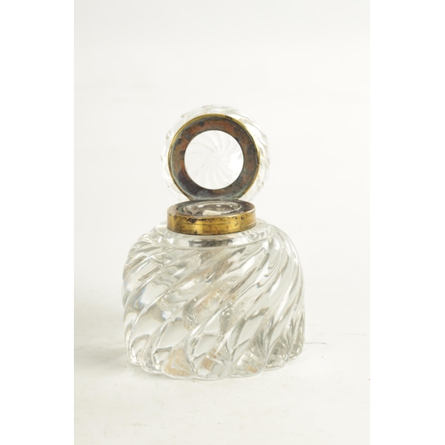 6 - A LATE 19TH CENTURY OVERSIZED DESK INK BOTTLE BACCARAT STYLE of swirl fluted moulded design with hin... 