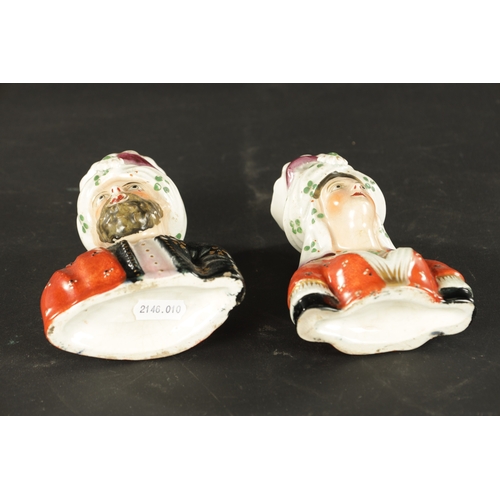 63 - A PAIR OF 19TH CENTURY FIGURAL STAFFORDSHIRE VASES modelled as Abdul Karim and Queen Victoria. (13cm... 