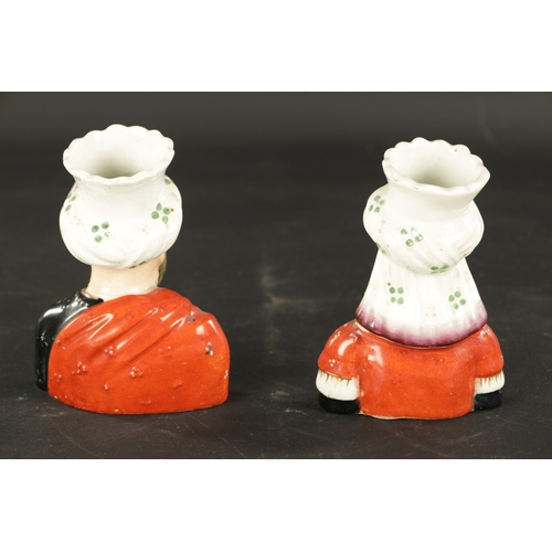 63 - A PAIR OF 19TH CENTURY FIGURAL STAFFORDSHIRE VASES modelled as Abdul Karim and Queen Victoria. (13cm... 