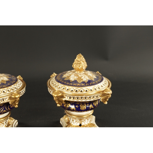 65 - A SET OF THREE 19TH CENTURY ROYAL CROWN DERBY POTPOURRI VASES, having pineapple finials and gilt mas... 