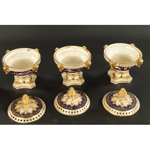 65 - A SET OF THREE 19TH CENTURY ROYAL CROWN DERBY POTPOURRI VASES, having pineapple finials and gilt mas... 