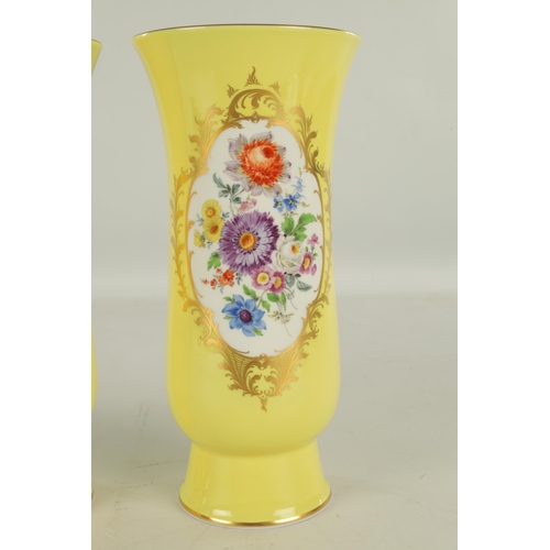 78 - A LARGE PAIR OF 19TH CENTURY MEISSEN PORCELAIN VASES on yellow ground having gilt edged panels of ha... 