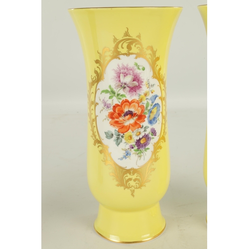 78 - A LARGE PAIR OF 19TH CENTURY MEISSEN PORCELAIN VASES on yellow ground having gilt edged panels of ha... 