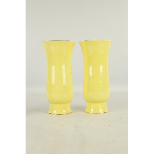 78 - A LARGE PAIR OF 19TH CENTURY MEISSEN PORCELAIN VASES on yellow ground having gilt edged panels of ha... 