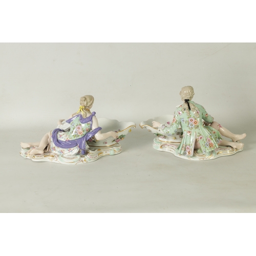 85 - A PAIR OF LATE 19TH CENTURY MEISSEN PORCELAIN FIGURAL SWEETMEAT DISHES depicting young lovers holdin... 