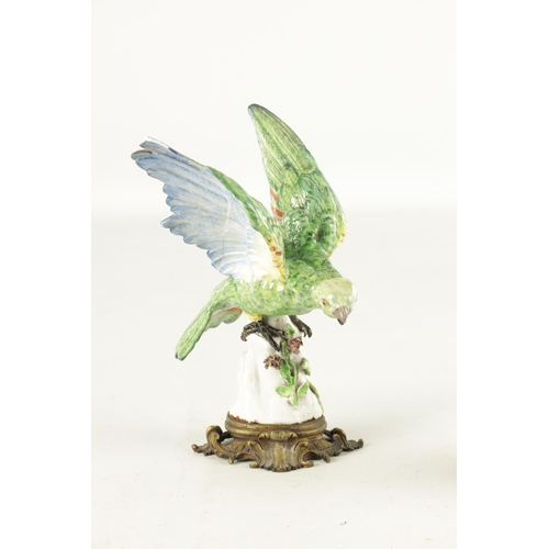 87 - A 19TH CENTURY MEISSEN PORCELAIN SCULPTURE OF A PARAKEET mounted on an ormolu base - painted cross s... 