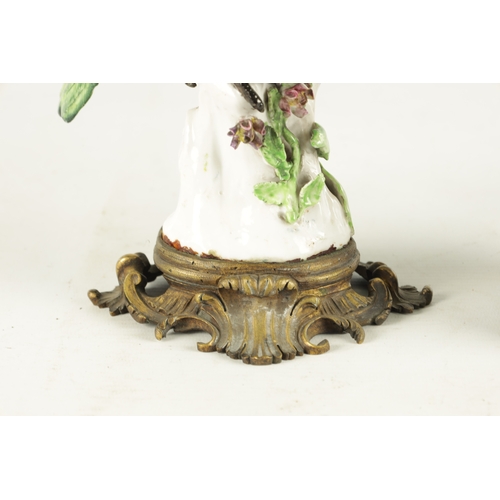 87 - A 19TH CENTURY MEISSEN PORCELAIN SCULPTURE OF A PARAKEET mounted on an ormolu base - painted cross s... 