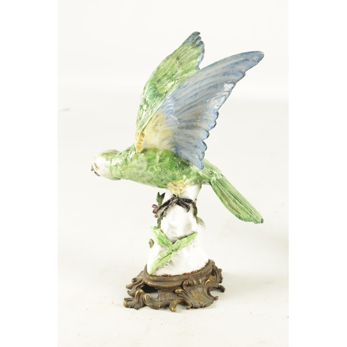 87 - A 19TH CENTURY MEISSEN PORCELAIN SCULPTURE OF A PARAKEET mounted on an ormolu base - painted cross s... 