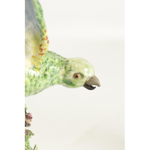 87 - A 19TH CENTURY MEISSEN PORCELAIN SCULPTURE OF A PARAKEET mounted on an ormolu base - painted cross s... 