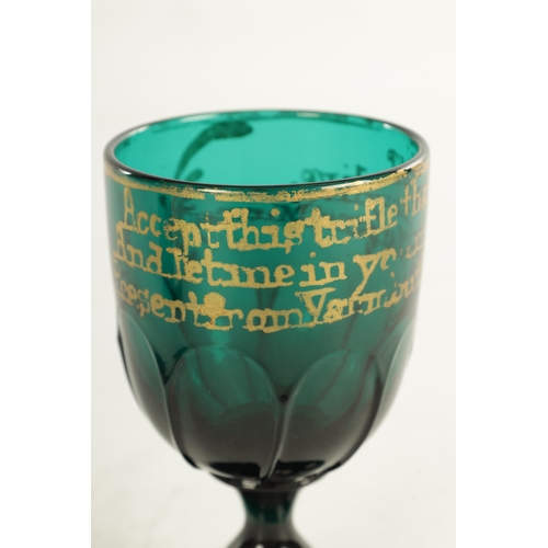 9 - A LATE GEORGIAN BRISTOL GREEN GLASS GOBLET with gilt presentation inscription and lobed lower body o... 