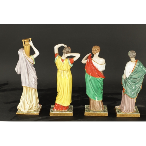 97 - A SET OF FOUR DRESDEN CLASSICAL MAIDEN FIGURES brightly coloured and stamped beneath. (24cm high and... 