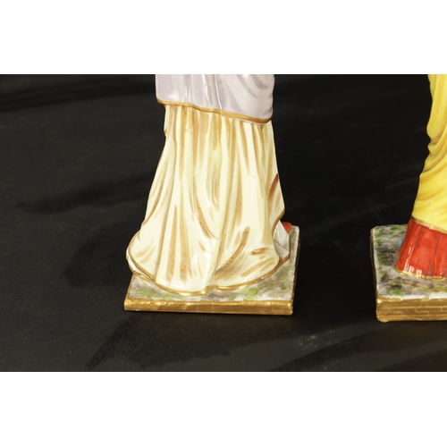 97 - A SET OF FOUR DRESDEN CLASSICAL MAIDEN FIGURES brightly coloured and stamped beneath. (24cm high and... 