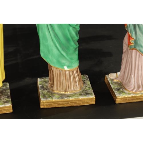 97 - A SET OF FOUR DRESDEN CLASSICAL MAIDEN FIGURES brightly coloured and stamped beneath. (24cm high and... 