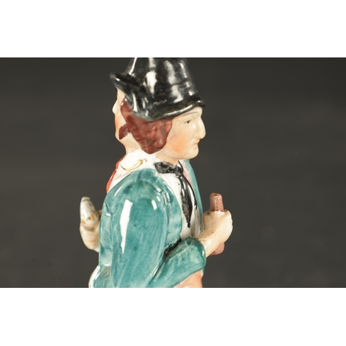 98 - A 19TH CENTURY STAFFORDSHIRE FIGURE ENTITLED WATER AND GIN (22cm high)