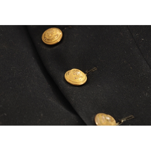 526 - A JAPANESE NAVAL OFFICER'S TAILCOAT with gilt brass buttons and embroidered collar.