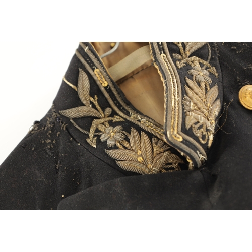 526 - A JAPANESE NAVAL OFFICER'S TAILCOAT with gilt brass buttons and embroidered collar.