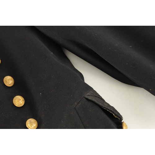 526 - A JAPANESE NAVAL OFFICER'S TAILCOAT with gilt brass buttons and embroidered collar.