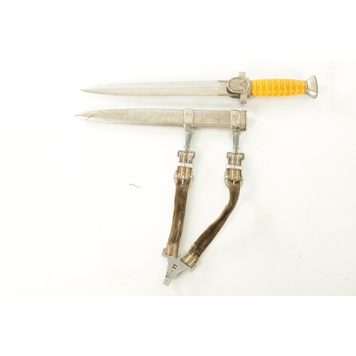 527 - A GERMAN WWII RED CROSS OFFICERS DAGGER WITH ORIGINAL HANGERS AND PORTEPEE with double-edged diamond... 