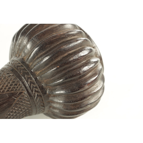 533 - A 19TH CENTURY FIJIAN CLUB with a carved bulbous head and chequer-carved decorated neck (48cm overal... 