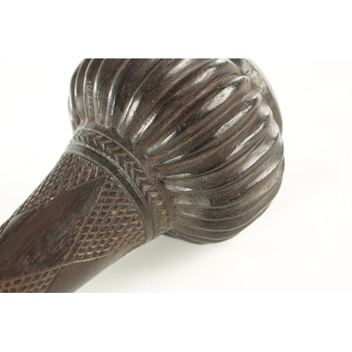 533 - A 19TH CENTURY FIJIAN CLUB with a carved bulbous head and chequer-carved decorated neck (48cm overal... 